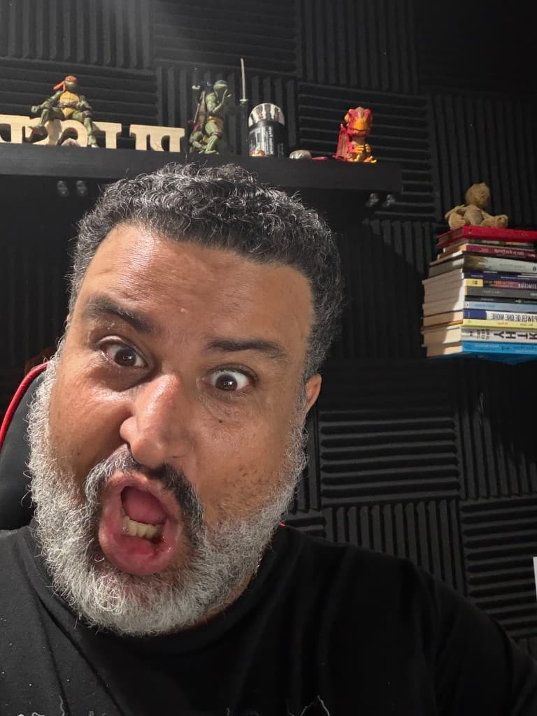Giuseppe mid-performance with an expressive shocked face in the studio