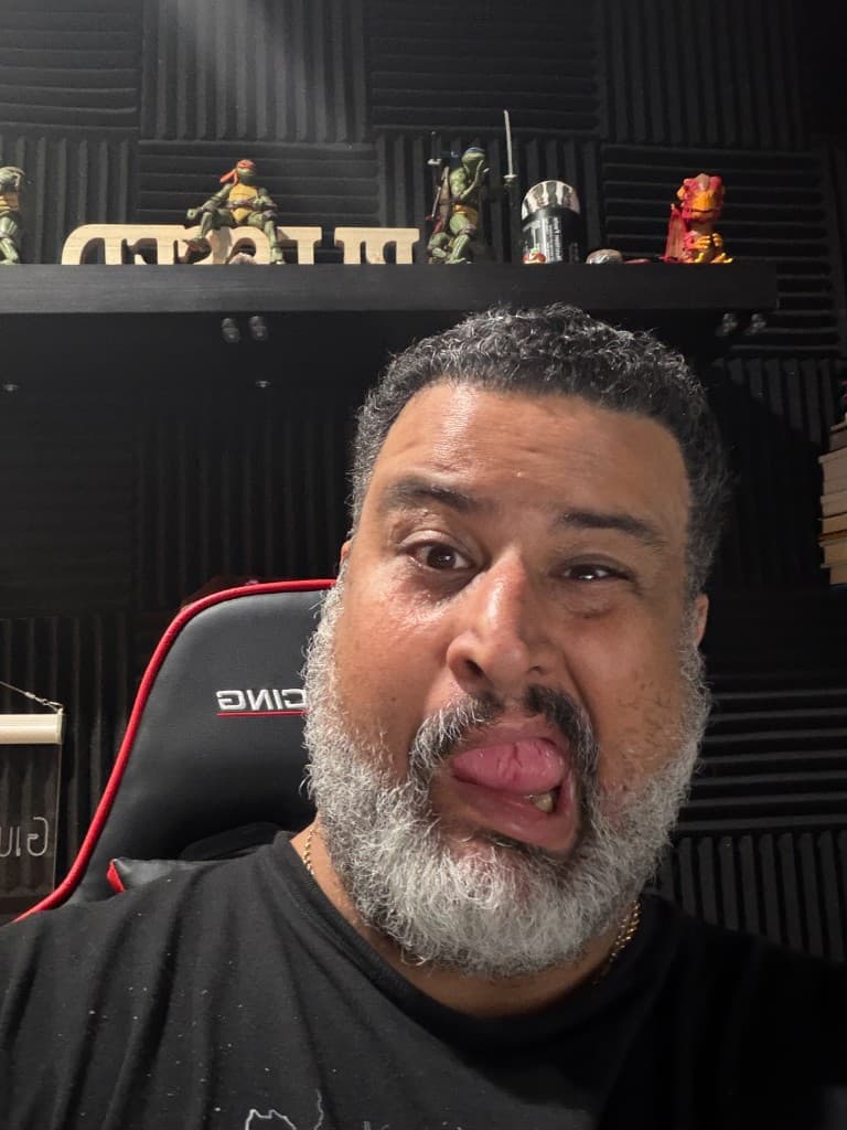 Giuseppe sticking his tongue out playfully in his home studio