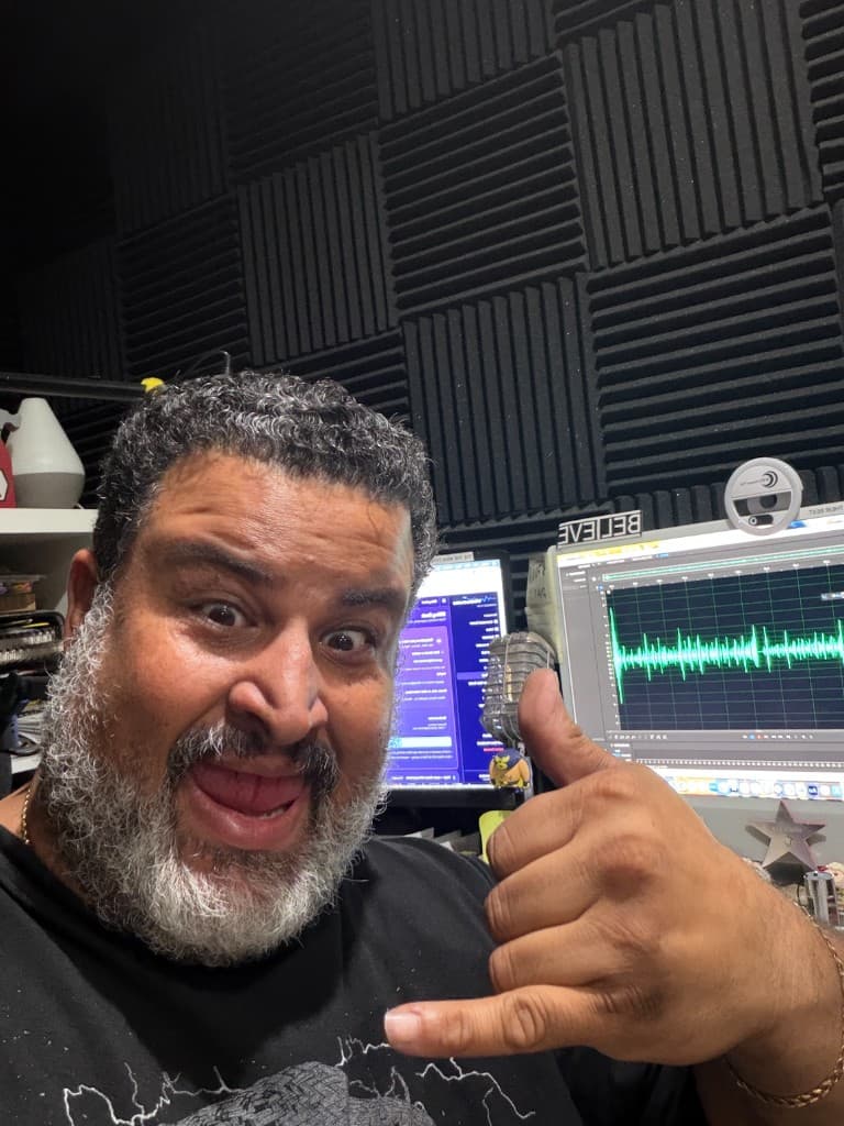 Giuseppe hanging loose at the mic with monitors and DAW visible